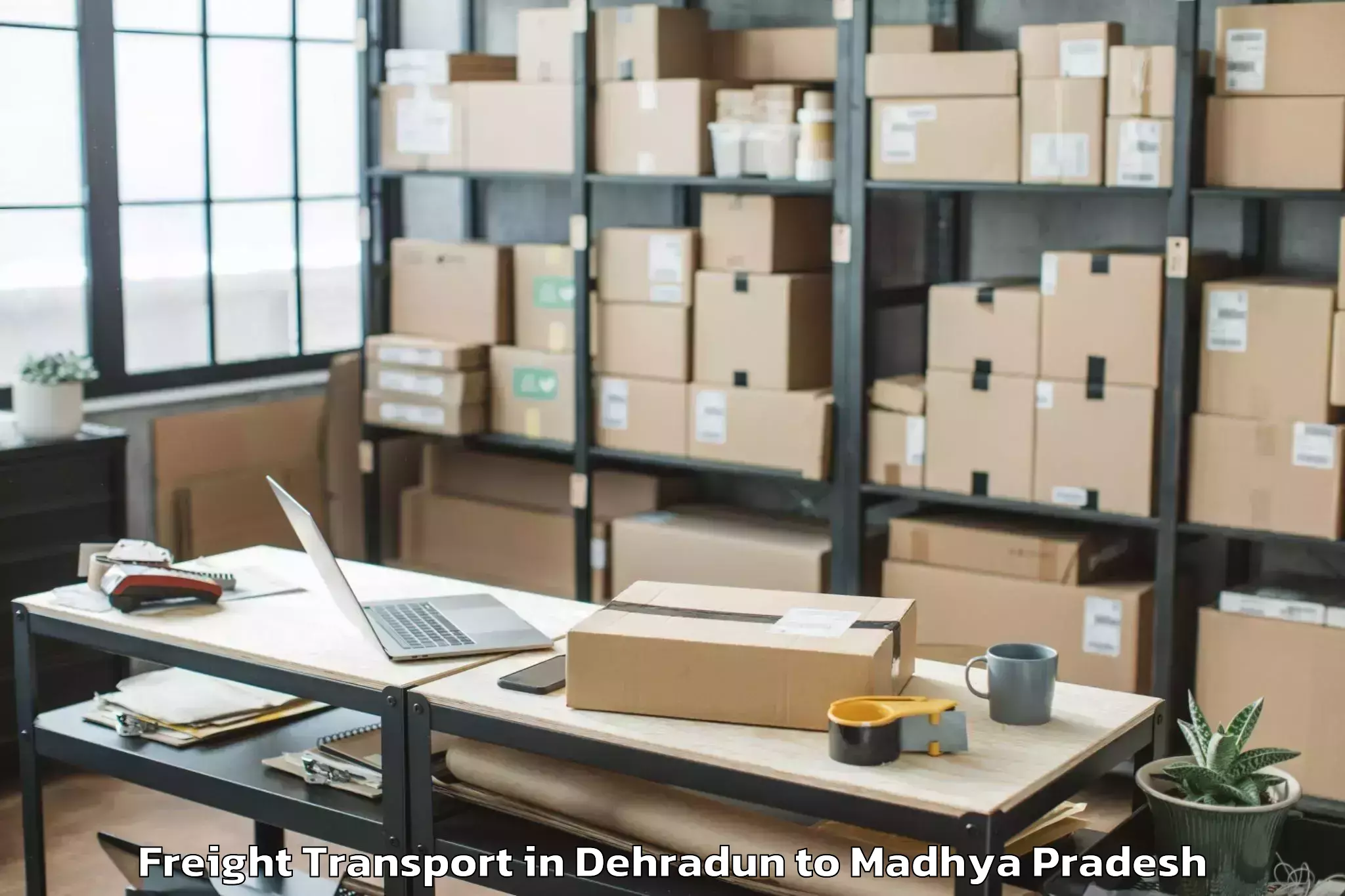 Professional Dehradun to Agar Freight Transport